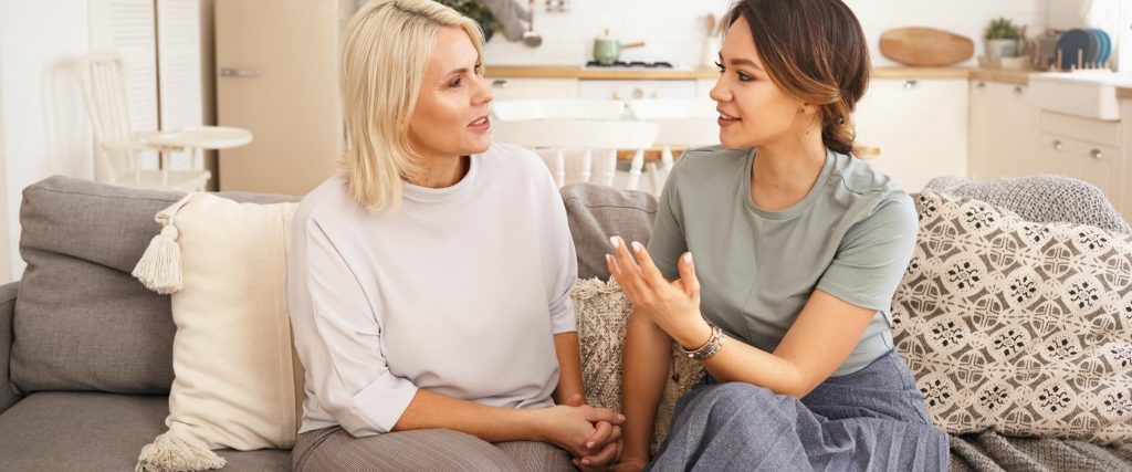 two moms talking to each other