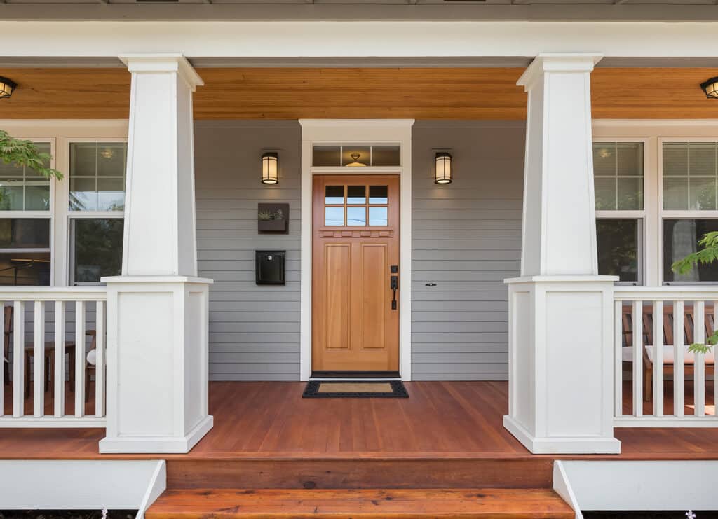 front door and porch of expensive looking home