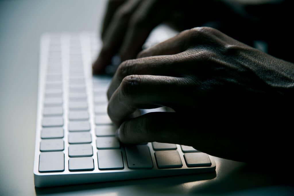 closeup of hands on keyboard